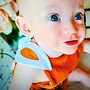 Hunter joined the competition — help win amazing prizes! baby, child, blue_eyes, close_up, orange_clothing, white_clothing_detail, infant, face, portrait, cute, soft_skin, indoor, young_child, smiling, happy, person, toddler, eyelashes, cheeks, bright_eyes