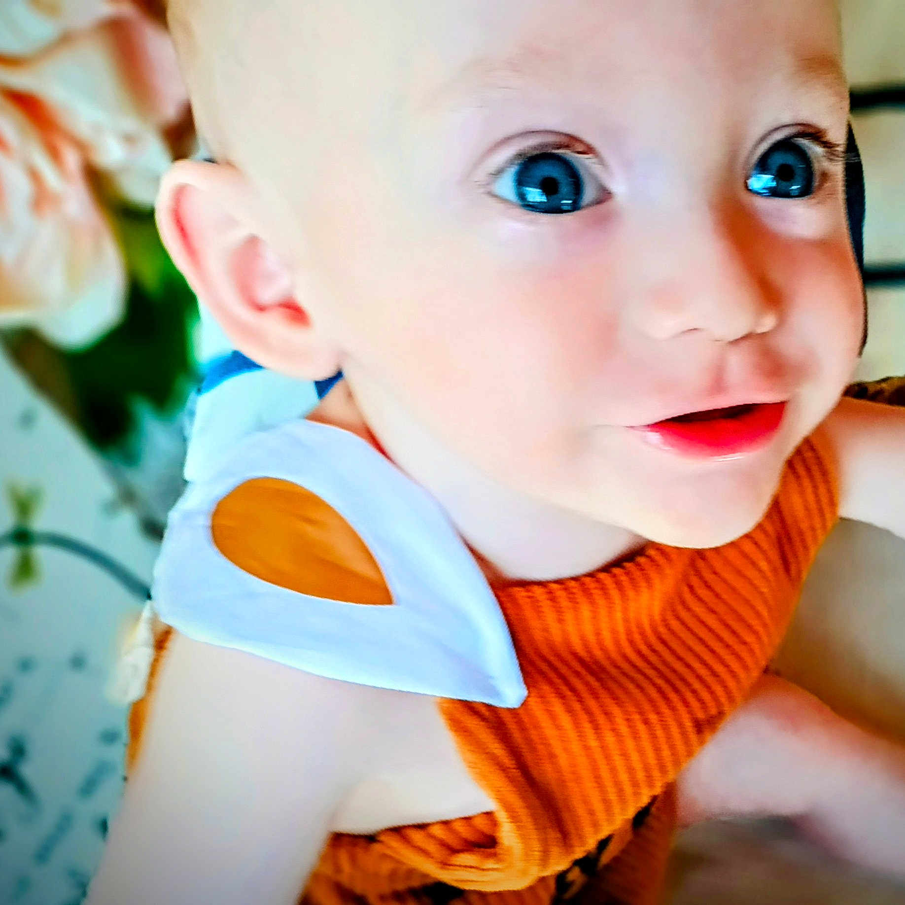 Hunter joined the competition — help win amazing prizes! baby, blue_eyes, bright_eyes, cheeks, child, close_up, cute, eyelashes, face, happy, indoor, infant, orange_clothing, person, portrait, smiling, soft_skin, toddler, white_clothing_detail, young_child