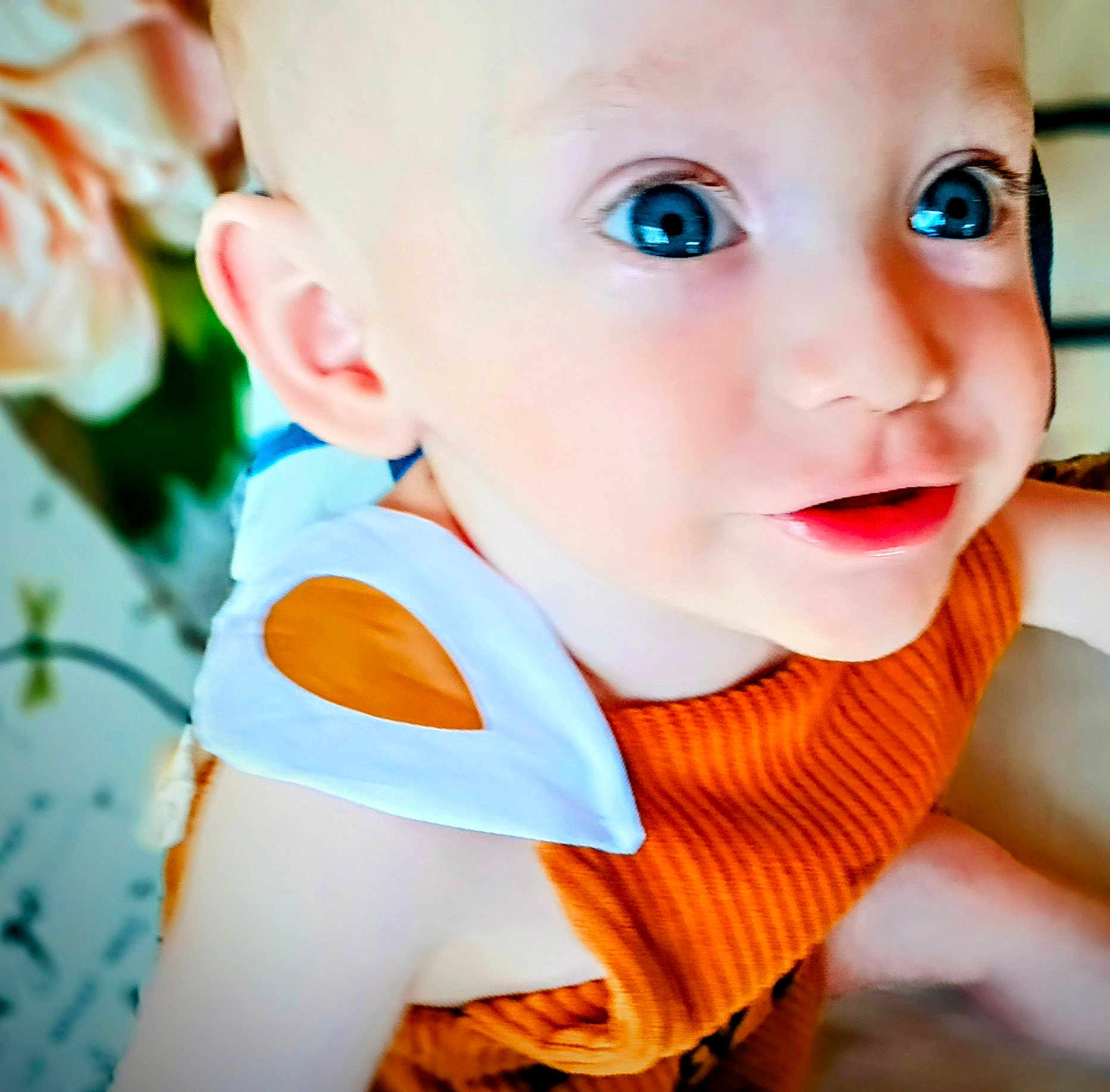 Hunter joined the competition — help win amazing prizes! baby, child, blue_eyes, close_up, orange_clothing, white_clothing_detail, infant, face, portrait, cute, soft_skin, indoor, young_child, smiling, happy, person, toddler, eyelashes, cheeks, bright_eyes