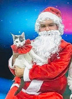 Baby is registered to the contest to win money with this photo: beard, carnivore, cat, christmas, christmas_eve, electric_blue, event, facial_hair, felidae, fictional_character, fun, fur, happy, hat, holiday, lap, santa_claus, small_to_medium_sized_cats, whiskers, winter