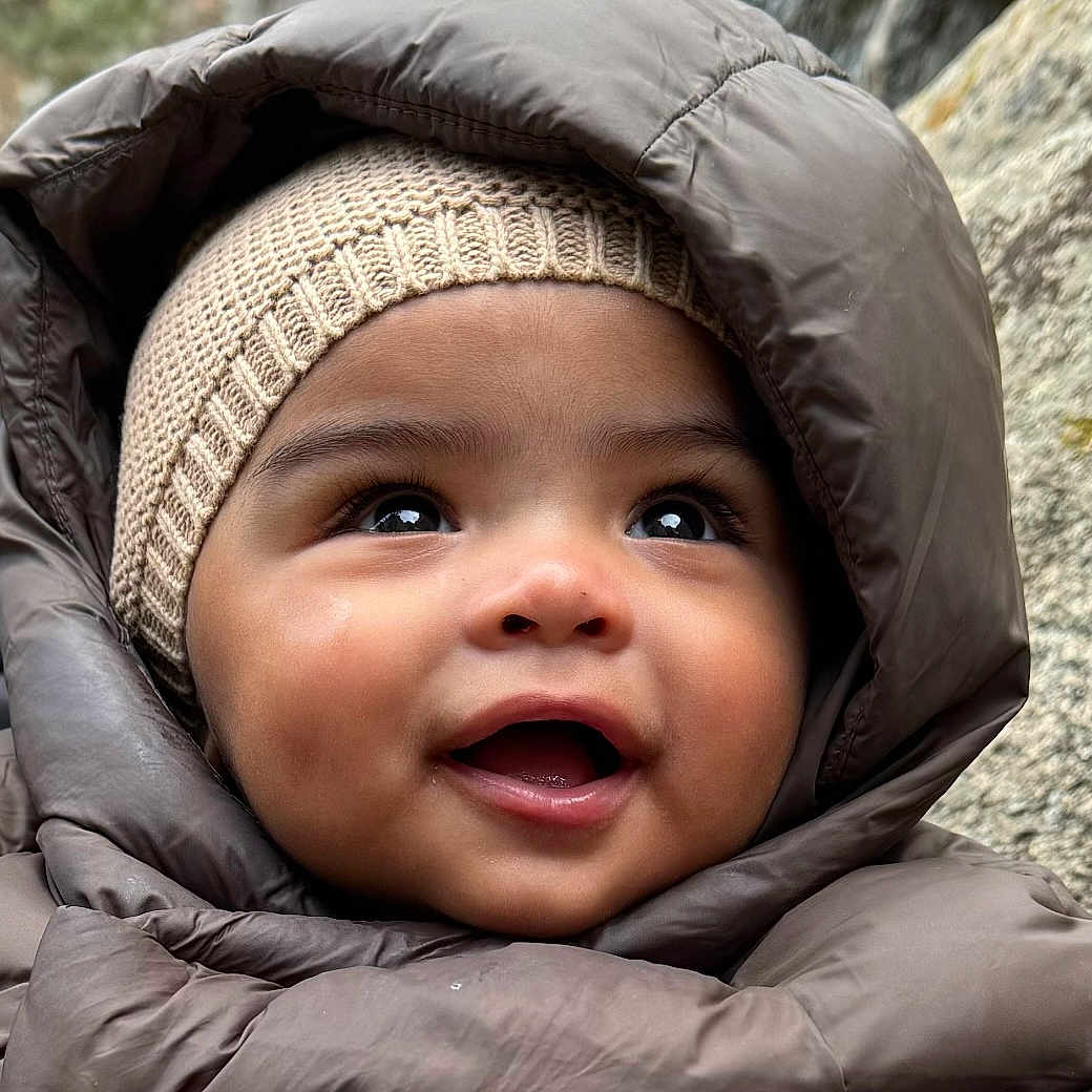 Valentino joined the competition — help win amazing prizes! baby, babylaughing, bonnet, cap, clothing, coat, face, happy, hat, head, hood, hoodie, jacket, knitwear, person, photography, portrait, smile, sweater, sweatshirt