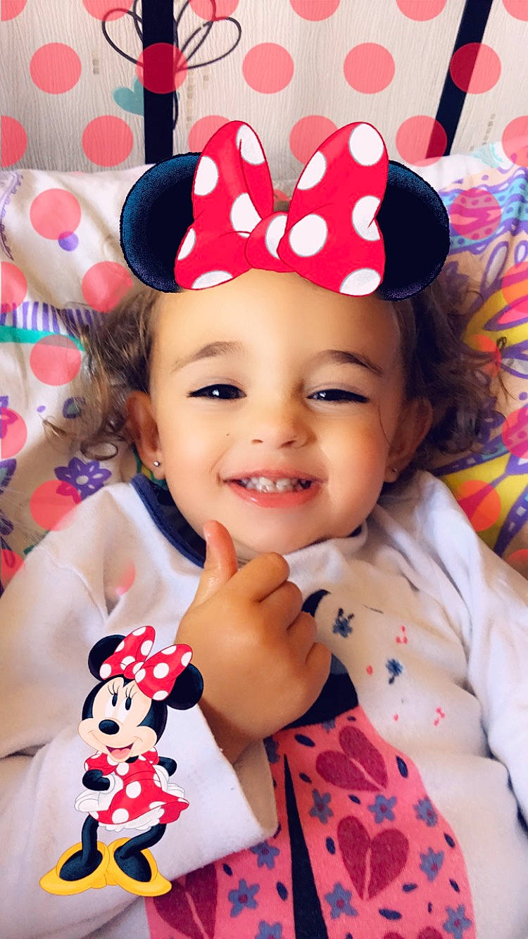 Nélia a rejoint le concours — aidez-le/la à gagner de superbes lots ! baby_toddler_clothing, cap, child, clothing, costume_hat, face, facial_expression, fun, happy, hat, head, headgear, human, joy, person, pink, product, red, skin, smile