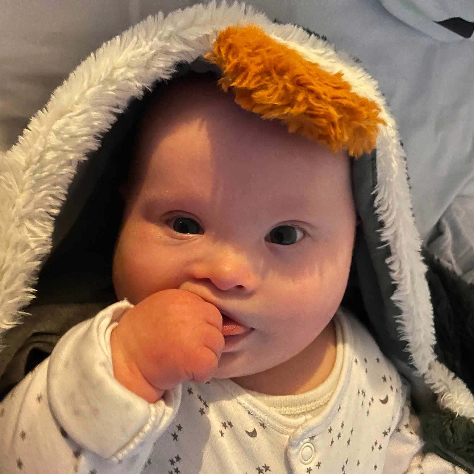 Manny is registered to the contest to win money with this photo: baby, baby_toddler_clothing, cap, cheek, child, ear, eye, eyebrow, eyelash, face, facial_expression, headgear, iris, lip, nose, organ, skin, sleeve, textile, toddler