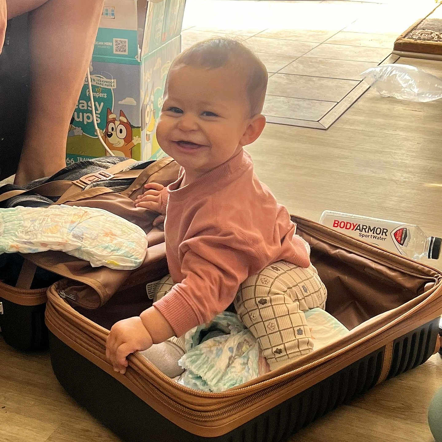 Paislie joined the competition — help win amazing prizes! adult, animal, baby, baggage, basket, canine, crib, face, furniture, happy, head, infantbed, male, man, person, photography, portrait, sitting, smile, suitcase