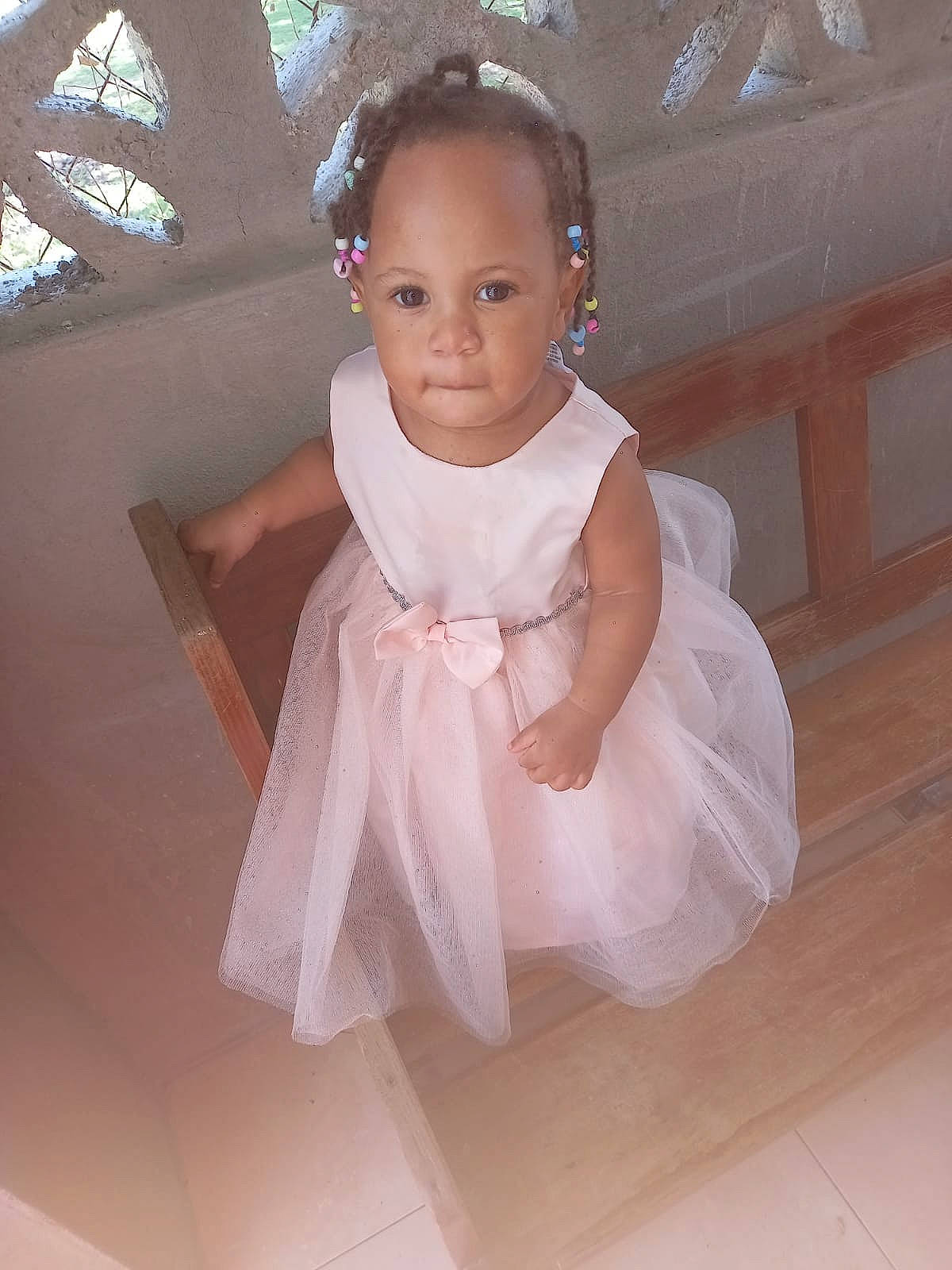 Brielle is registered to the contest to win money with this photo: baby, baby_toddler_clothing, bridal_accessory, bridal_clothing, bridal_party_dress, day_dress, dress, embellishment, flash_photography, flooring, formal_wear, gown, happy, iris, neck, one_piece_garment, person, pink, skin, sleeve