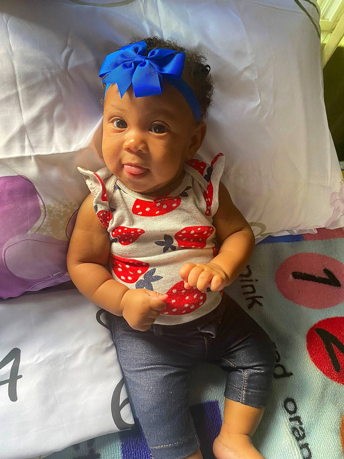Avyana is registered to the contest to win money with this photo: arm, baby, baby_products, baby_toddler_clothing, carmine, child, cool, fashion_accessory, fun, happy, headband, headwear, party_supply, person, personal_protective_equipment, pink, sitting, skin, t_shirt, toddler