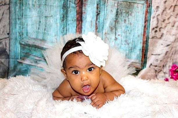 Bostyn is registered to the contest to win money with this photo: baby, child, fashion_accessory, fur, hair_accessory, headband, headgear, headpiece, headwear, person, photograph, photography, skin, smile, surprise, toddler