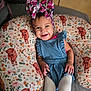 Evangeline joined the competition — help win amazing prizes! baby, child, smiling, headband, bow, romper, pillow, pattern, cow, animal_print, floral, cute, happy, infant, person, toddler, fabric, indoors, clothing, portrait