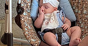 Danaerys joined the competition — help win amazing prizes! baby, infant, sleeping, baby_swing, headband, bib, cute, peaceful, indoor, carpet, floor_tiles, baby_clothes, patterned_fabric, animal_print, relaxed, person, foot, leg, resting, comfort