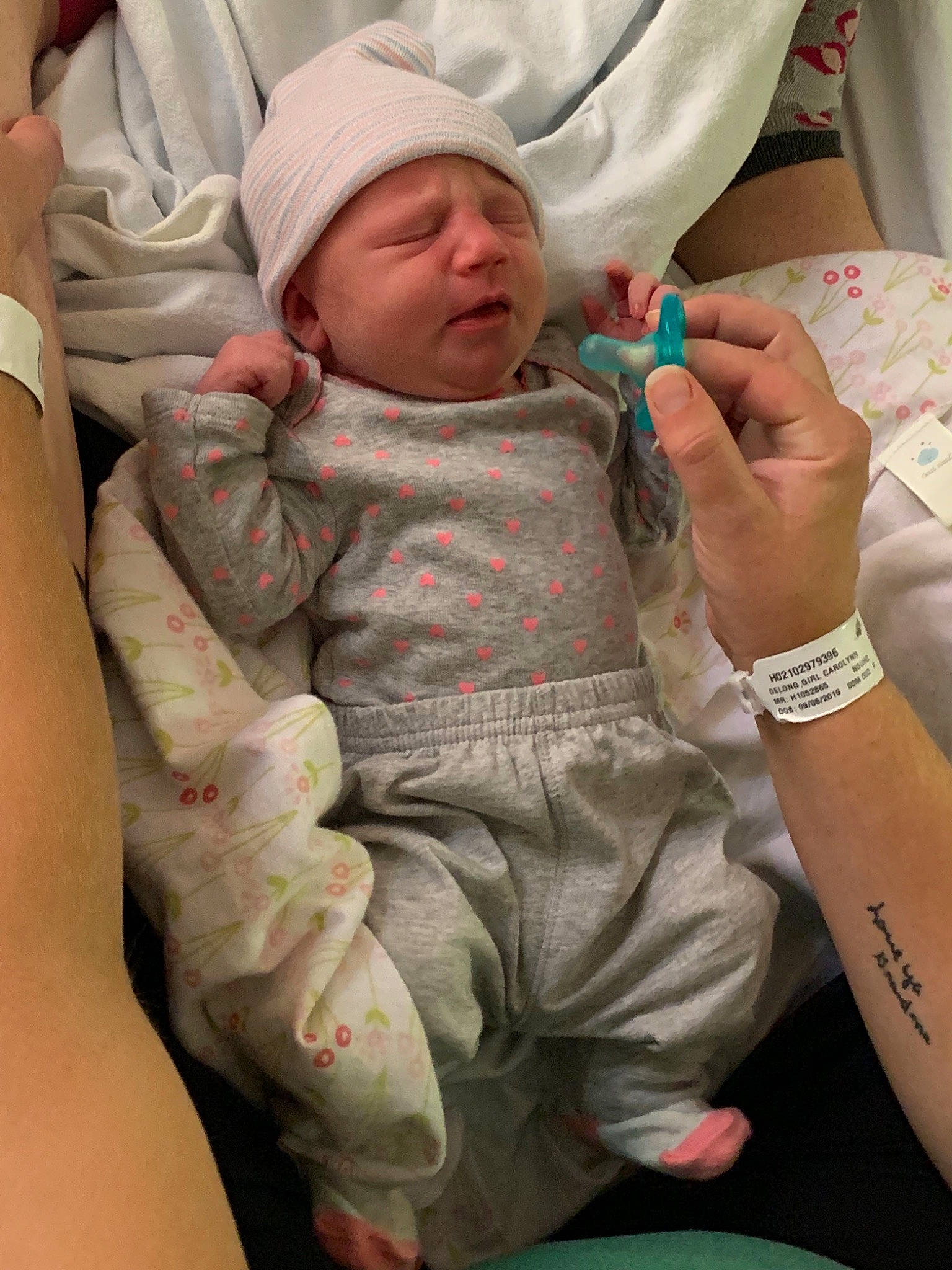 Emmalynn is registered to the contest to win money with this photo: arm, baby, birth, child, childbirth, headwear, person, toddler