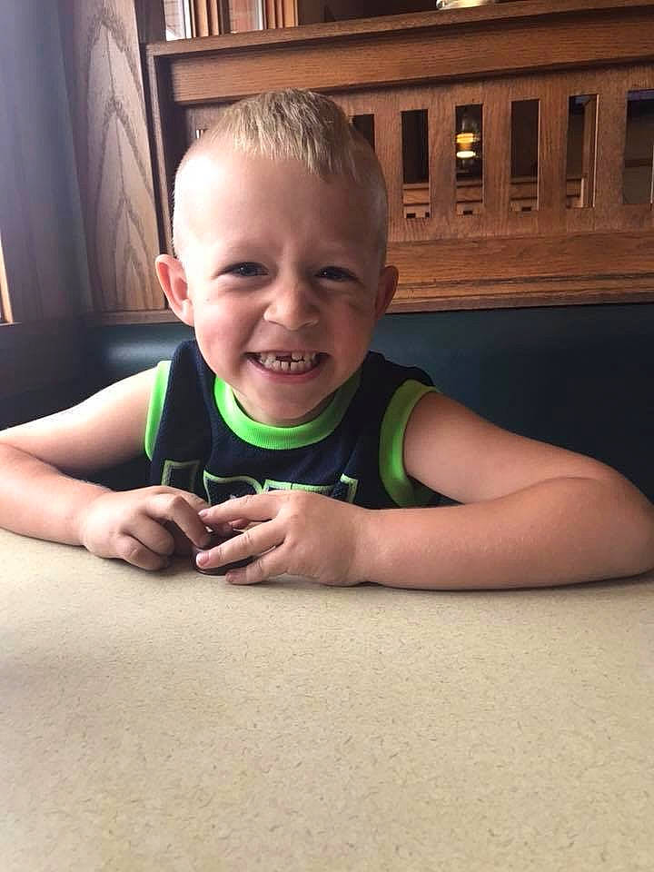 Archer is registered to the contest to win money with this photo: arm, baby, cheek, child, eye, face, facial_expression, fun, grass, green, hand, head, joy, leg, nose, person, play, skin, smile, summer