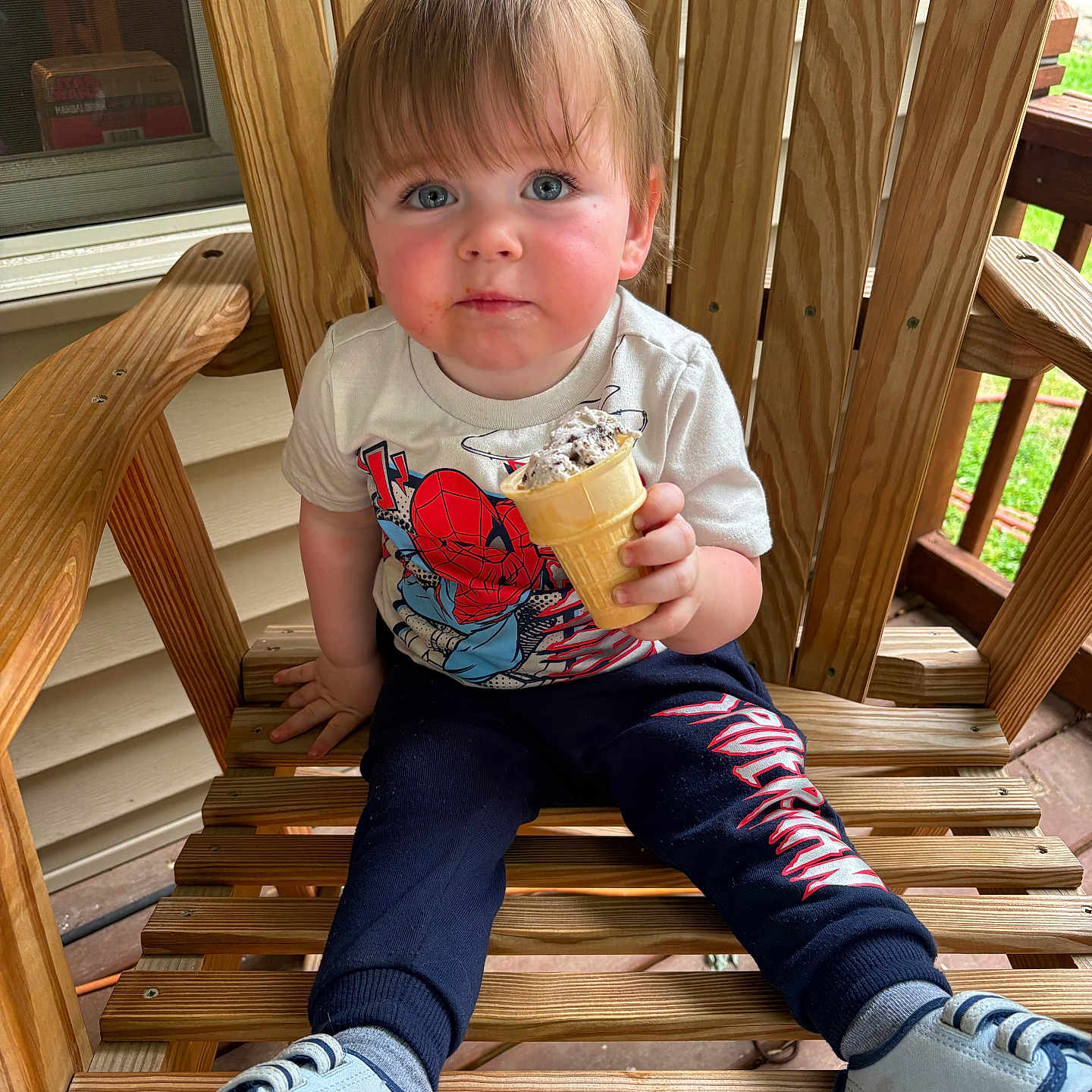 Asher joined the competition — help win amazing prizes! toddler, child, ice_cream, wooden_chair, outdoor, spiderman, sneakers, blue_eyes, rosy_cheeks, casual_clothing, porch, wood, summer, snack, cute, curious, sitting, person, daylight, young_child