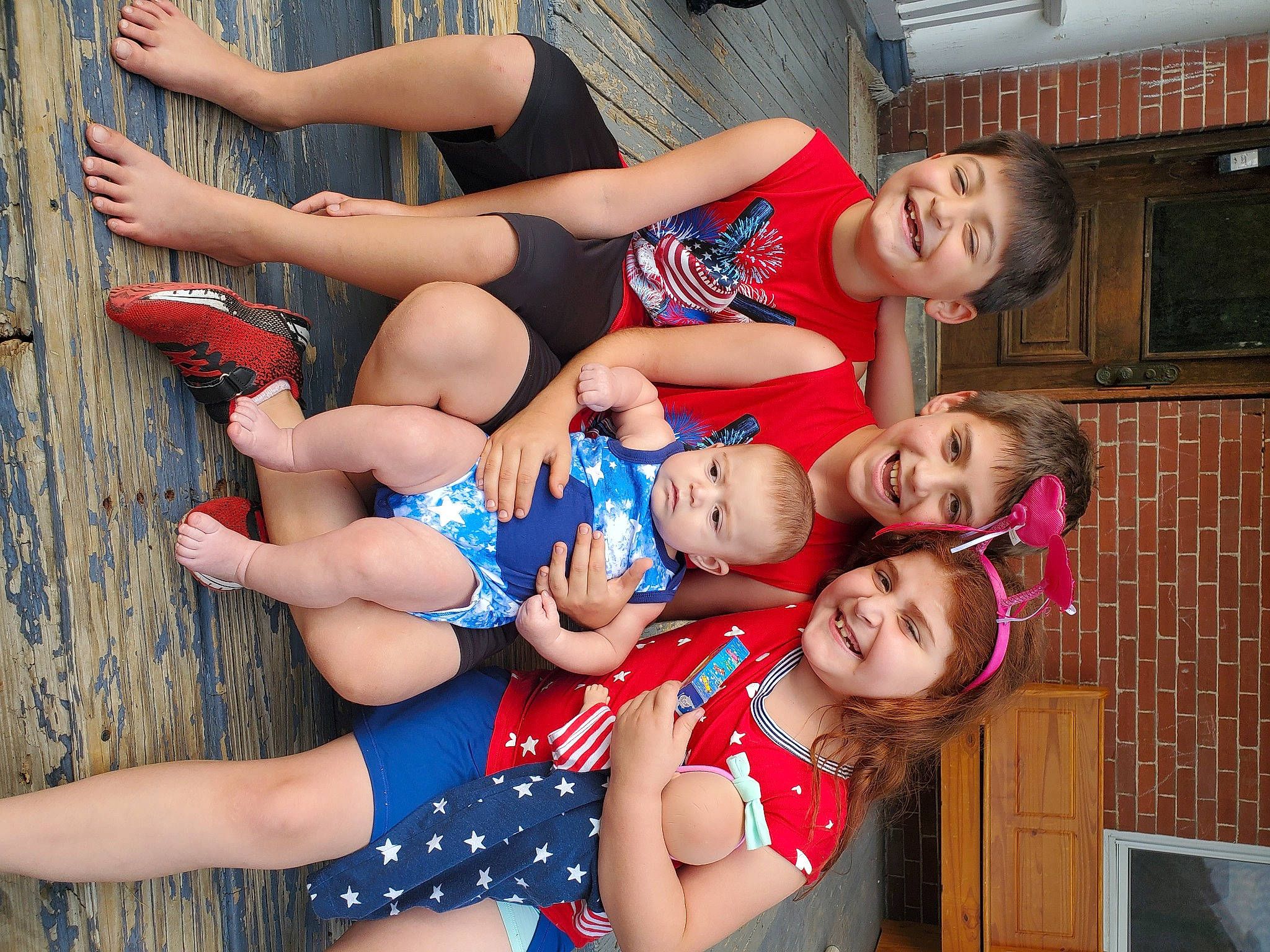 Joey Jr is registered to the contest to win money with this photo: abdomen, baby_toddler_clothing, blue, chest, electric_blue, event, face, foot, fun, happy, human_leg, joy, knee, leg, leisure, muscle, person, red, shorts, smile