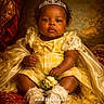 baby, child, tiara, dress, yellow_dress, flower_bouquet, portrait, indoor, royal, smiling, curly_hair, sitting, cute, infant, face, pretty, luxury, fabric, lace, gold