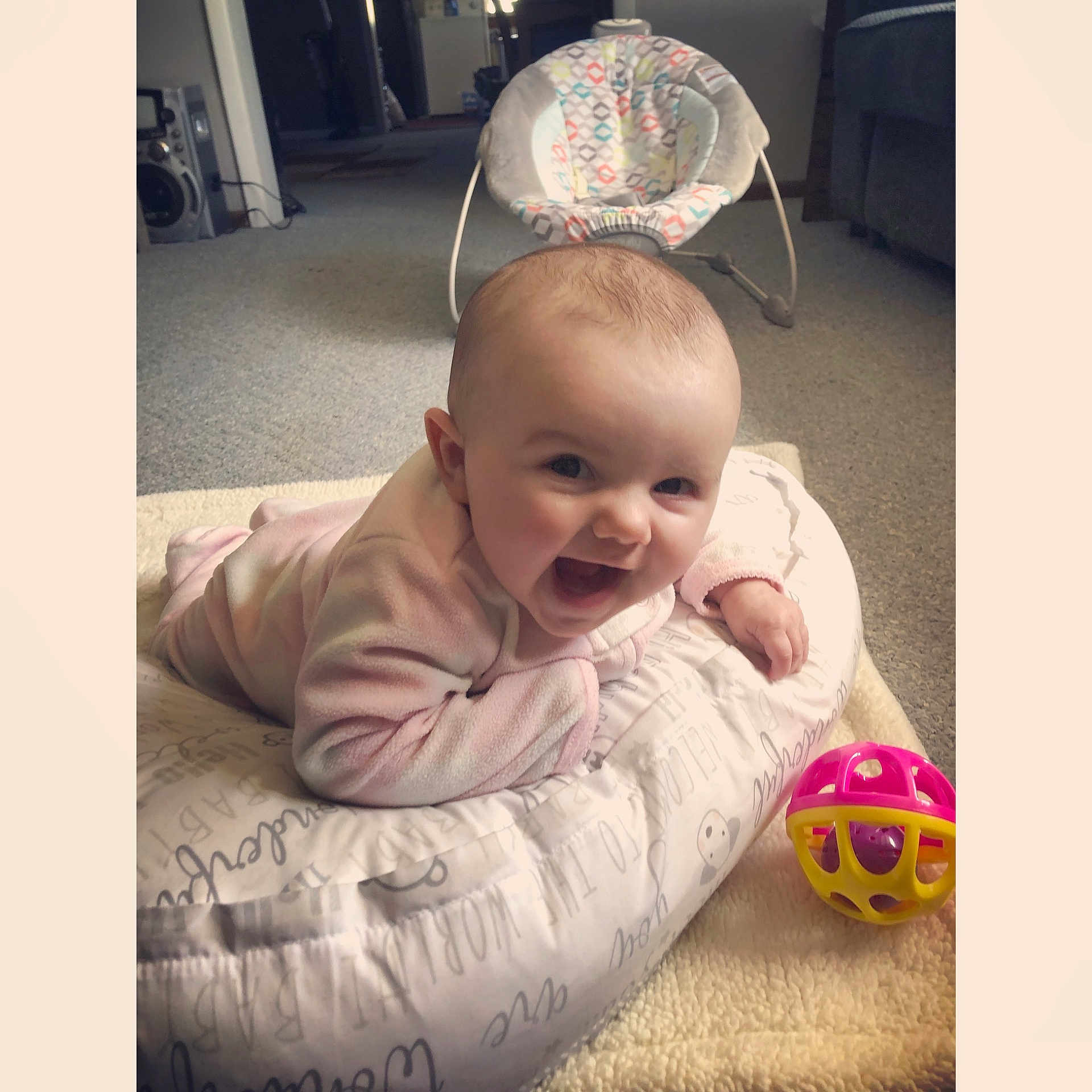 Lainey is registered to the contest to win money with this photo: baby, baby_laughing, cheek, child, ear, face, hair_accessory, head, headband, headgear, mouth, person, photo_caption, play, sitting, smile, toddler, tummy_time