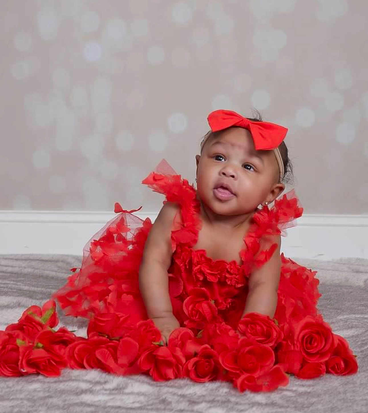 Honor joined the competition — help win amazing prizes! baby, red_dress, headband, roses, flower, curious, portrait, indoor, cute, infant, tulle, soft_background, carpet, adorable, child, smiling, happy, person, fashion, celebration