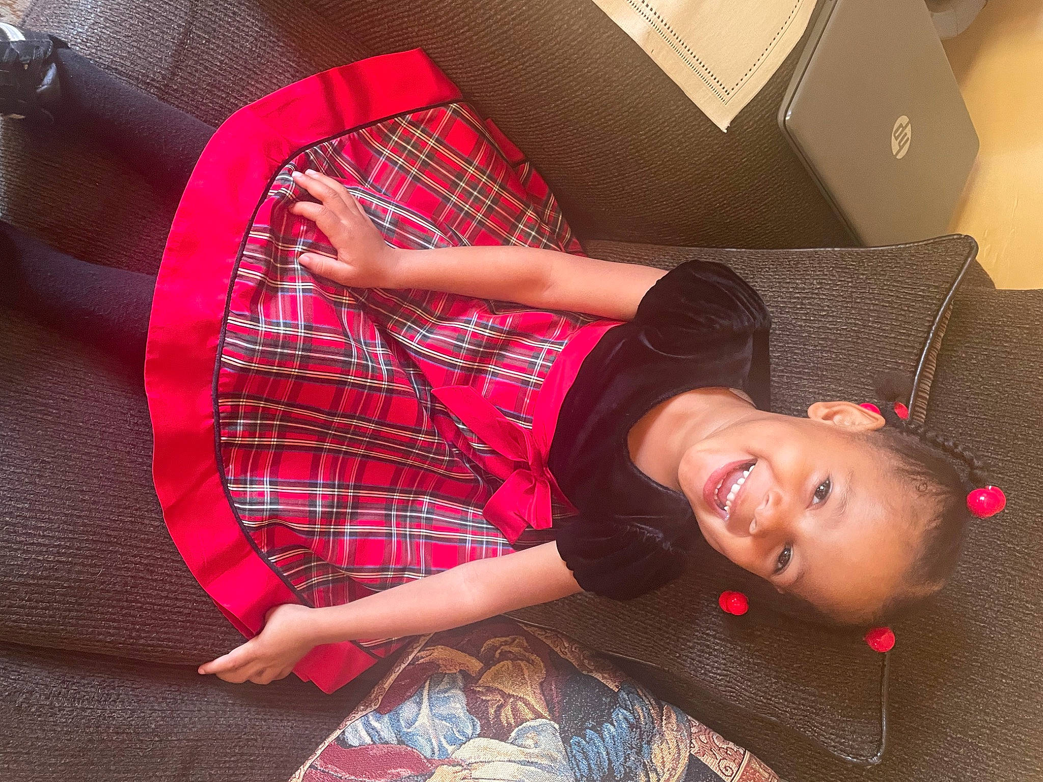Kaylea is registered to the contest to win money with this photo: carmine, carton, child, collar, comfort, fashion_accessory, flash_photography, fun, happy, human_leg, joy, magenta, pattern, person, plaid, room, shipping_box, sitting, sleeve, smile
