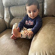 Sultan joined the competition — help win amazing prizes! toddler, child, couch, indoor, clothing, foot, pajamas, sitting, curious, face, person, home, leisure, comfort, cute, young, portrait, relaxed, skin, hair