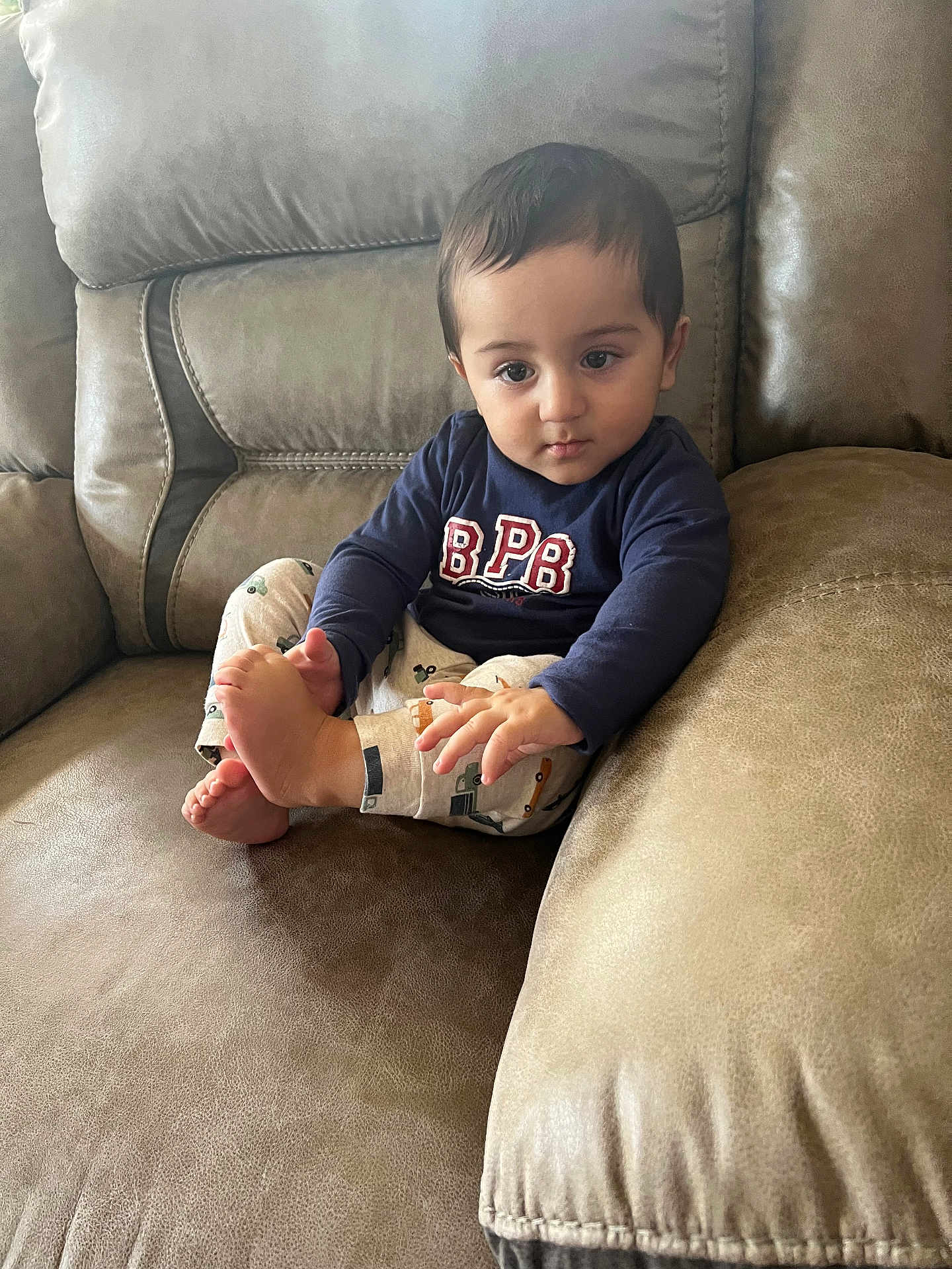 Sultan joined the competition — help win amazing prizes! toddler, child, couch, indoor, clothing, foot, pajamas, sitting, curious, face, person, home, leisure, comfort, cute, young, portrait, relaxed, skin, hair