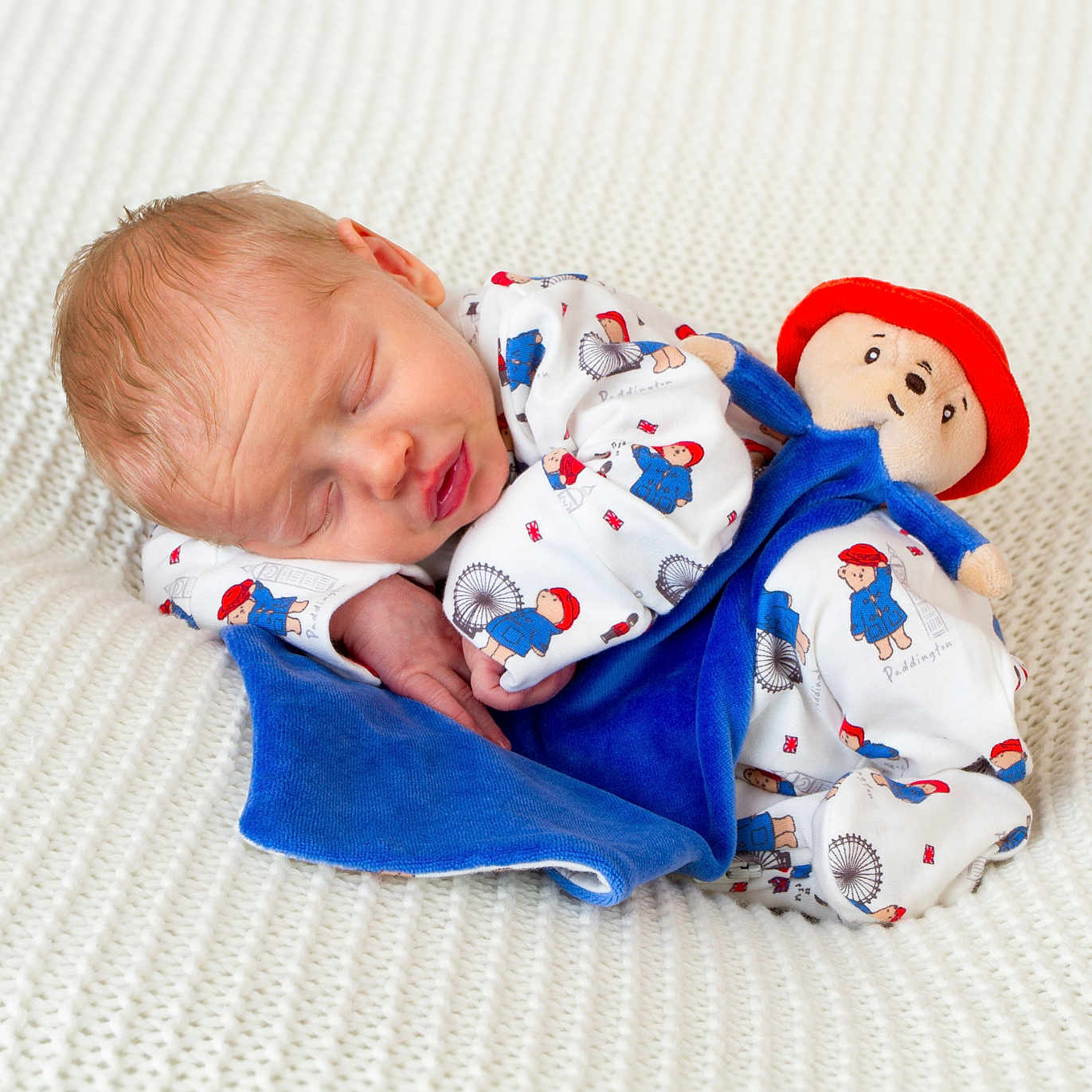 Oakley joined the competition — help win amazing prizes! baby, blanket, bodypart, cap, clothing, couch, doll, face, finger, furniture, glove, hand, hat, head, newborn, person, photography, portrait, sleeping, toy