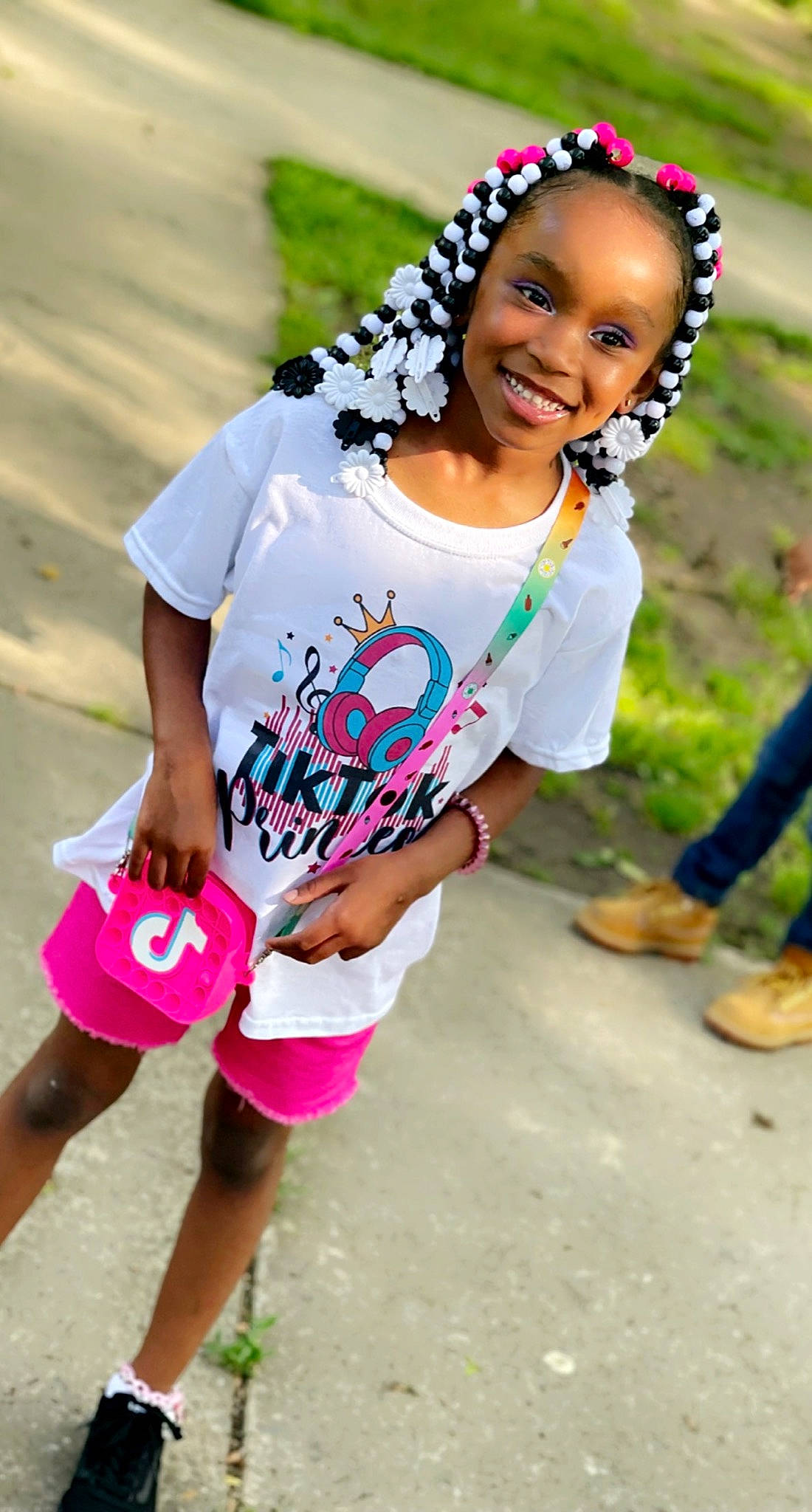 Skylar is registered to the contest to win money with this photo: black_hair, dress, eye, flip_flops, fun, grass, hairstyle, happy, joy, leisure, person, photograph, pink, recreation, sandal, shoe, skin, sleeve, smile, sneakers