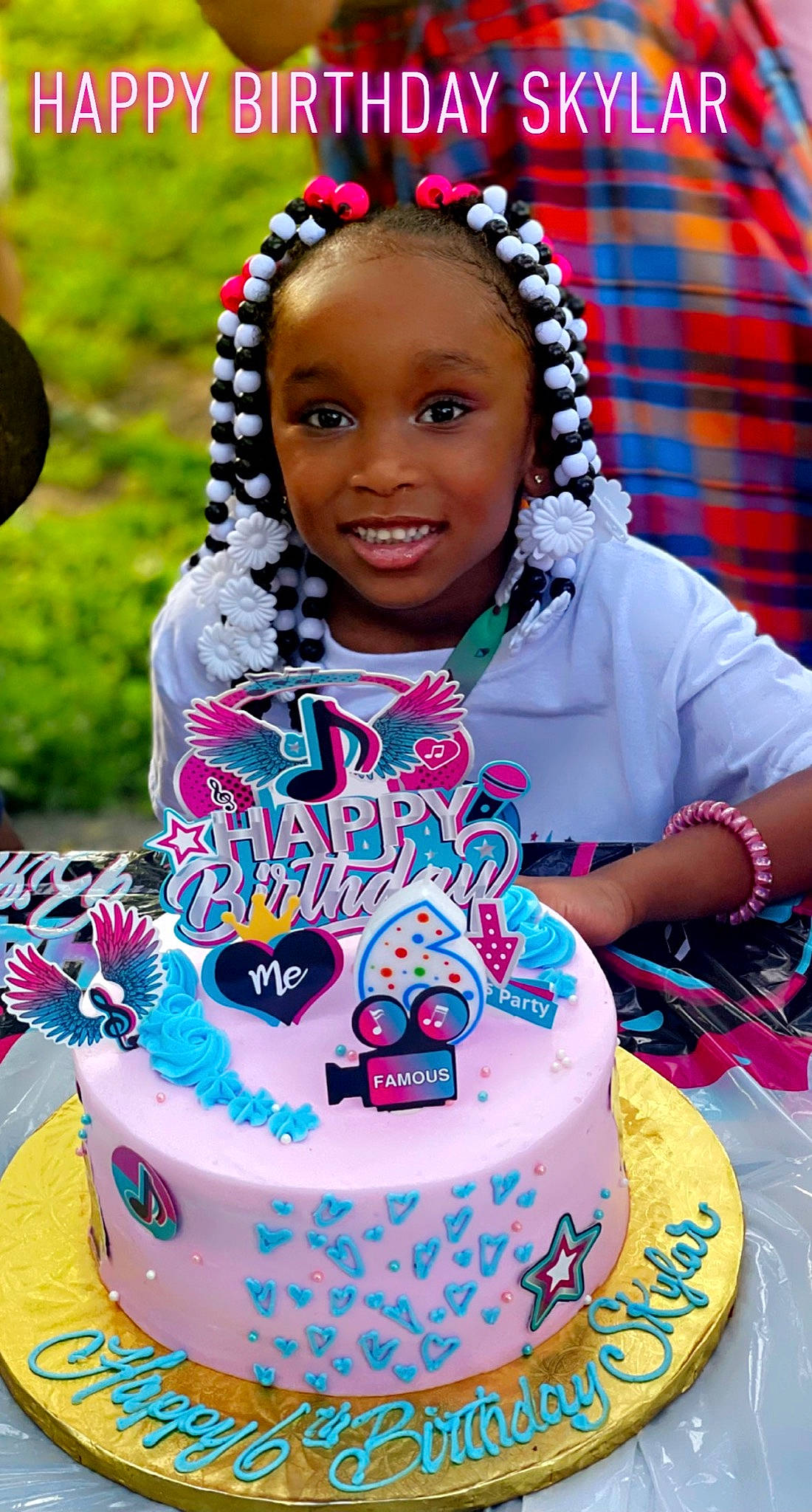 Skylar joined the competition — help win amazing prizes! blue, cake, cake_decorating_supply, child, event, facial_expression, fun, green, happy, jewellery, joy, leisure, magenta, people, person, pink, plaid, purple, red, smile