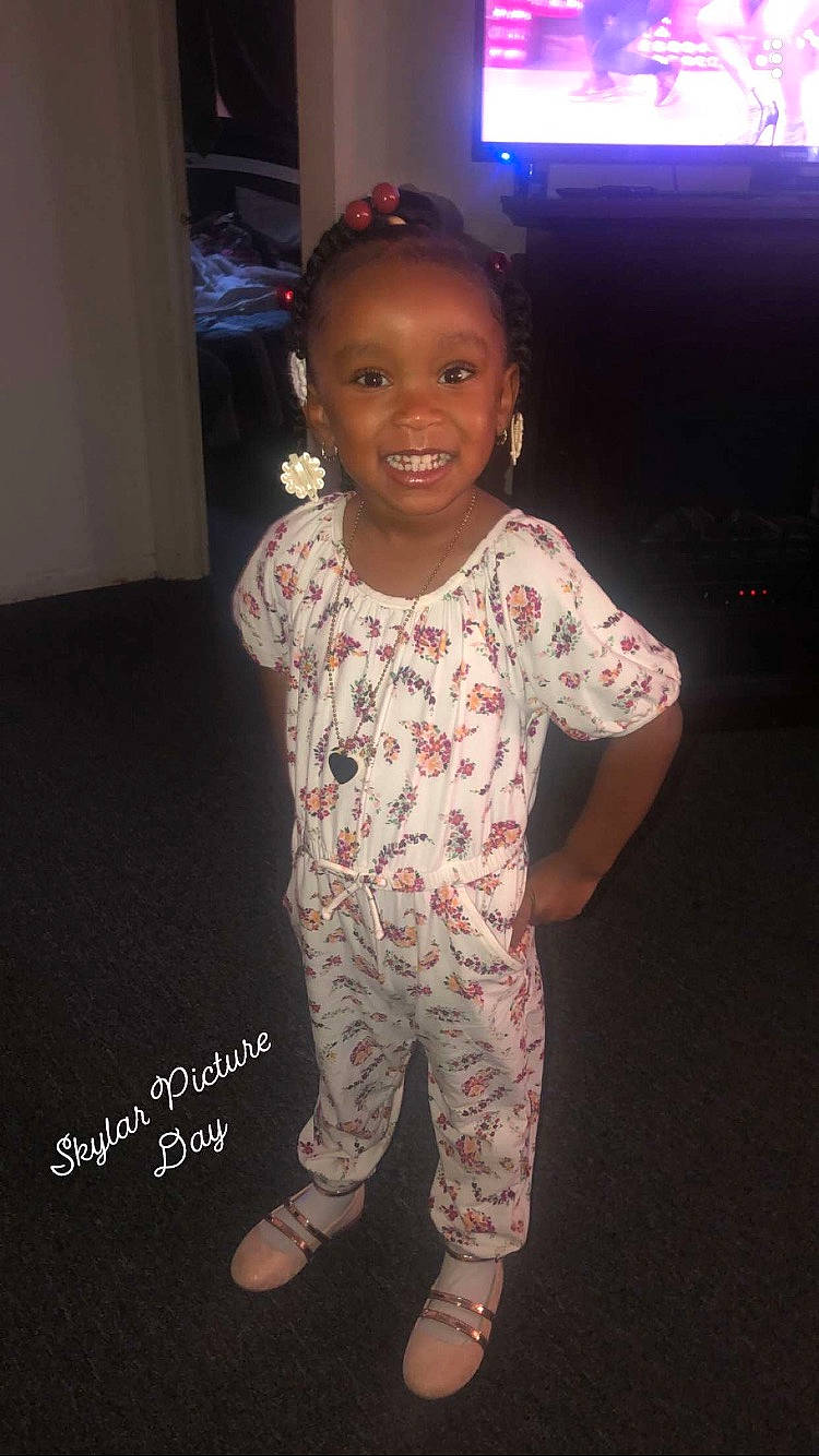 Skylar is registered to the contest to win money with this photo: baby_toddler_clothing, cheek, cool, electronic_device, eye, face, fashion_design, flash_photography, flooring, fun, hair, happy, head, human_body, joy, person, skin, sleeve, smile, standing