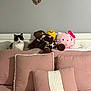 Michi is registered to the contest to win money with this photo: bed, brown, calico_cat, cat, cozy, cushion, decor, headboard, heart_decoration, hello_kitty, indoor, pet, pillow, pink, plush_toy, soft_toys, stuffed_animal, wall, white, yellow