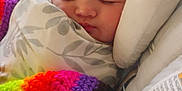Raelynn joined the competition — help win amazing prizes! baby, sleeping, blanket, crochet, colorful, infant, face, closeup, cozy, cushion, child, rest, indoor, soft, peaceful, comfort, person, wrapped, head, nap