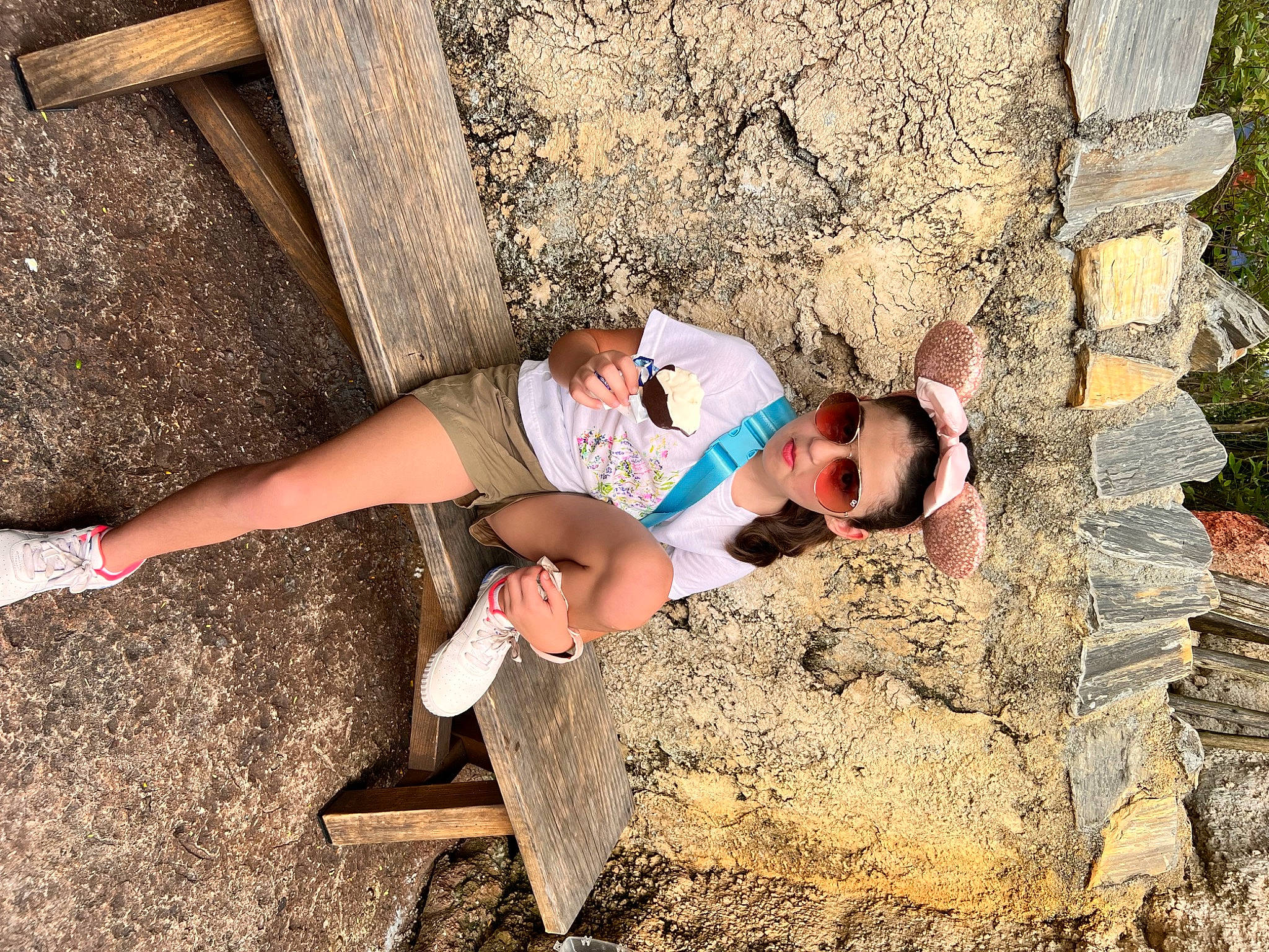 Madeline joined the competition — help win amazing prizes! bedrock, eyewear, foot, fun, glasses, grass, human_leg, landscape, leisure, people_in_nature, person, recreation, rock, shorts, sitting, soil, t_shirt, thigh, toddler, tree