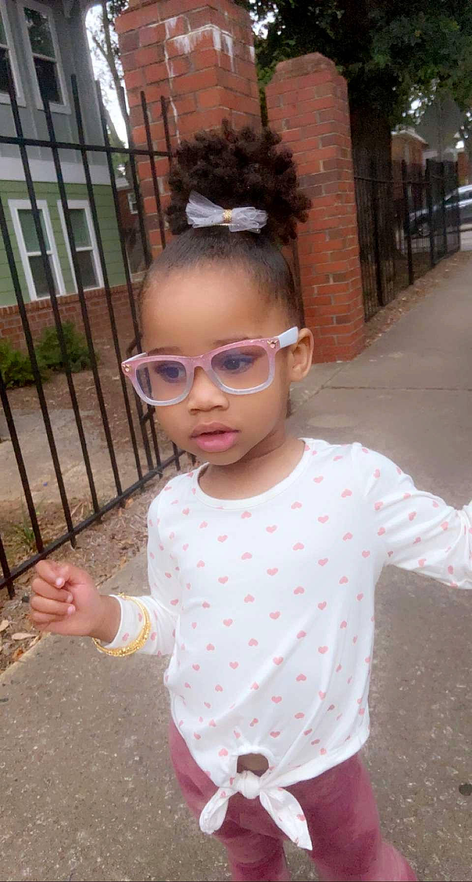 Reign is registered to the contest to win money with this photo: asphalt, baby_toddler_clothing, child, eyewear, fashion_accessory, fun, glasses, hairstyle, happy, pattern, people, person, personal_protective_equipment, pink, polka_dot, sleeve, standing, sunglasses, toddler, vacation