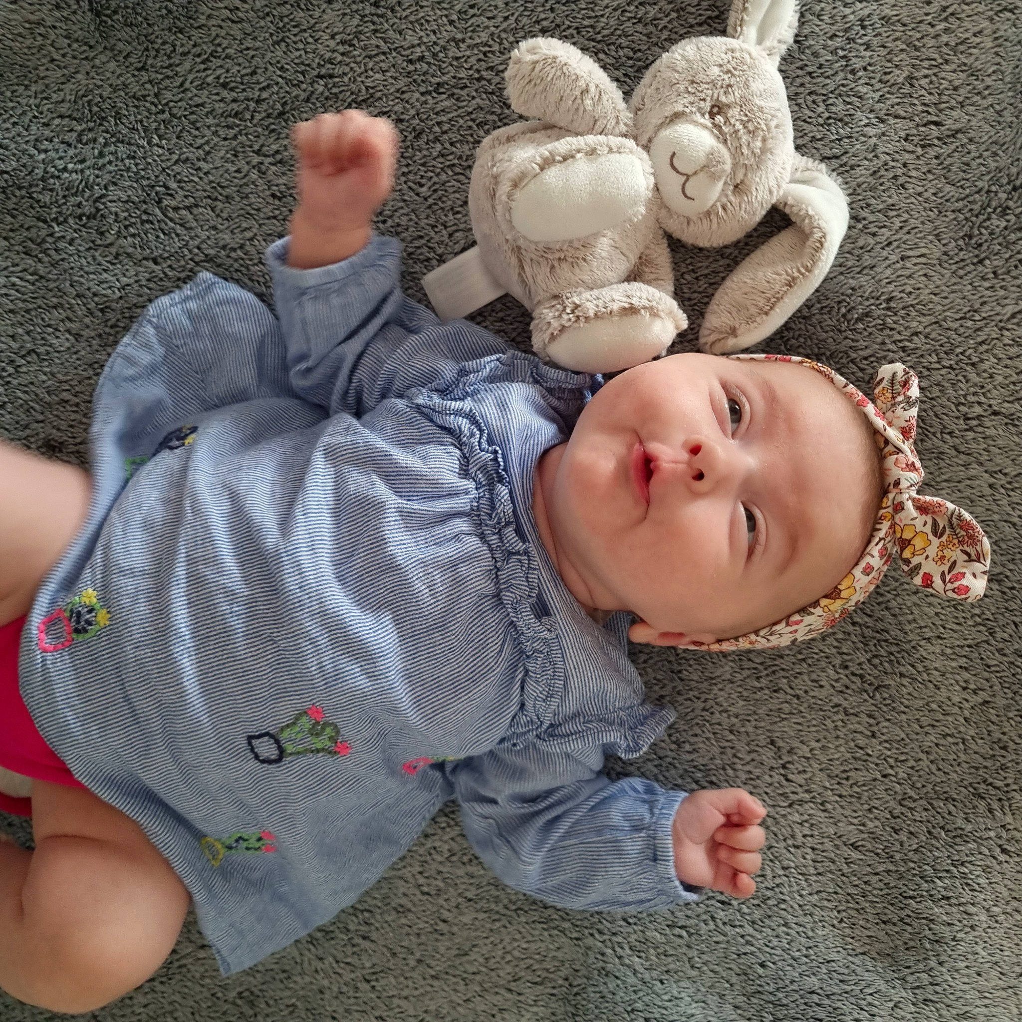 Judith participe au concours pour gagner de l'argent avec cette photo : arm, baby, baby_sleeping, baby_toddler_clothing, comfort, eye, finger, fun, gesture, happy, head, human_body, linens, nose, person, skin, sleeve, smile, toddler, toy