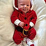 Jaxon joined the competition — help win amazing prizes! baby, infant, red_clothing, socks, blanket, smile, face, hood, christmas, holiday, cute, cozy, lying_down, indoors, wood_floor, white_blanket, festive, child, portrait, happy