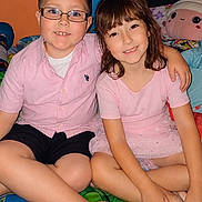 Thade joined the competition — help win amazing prizes! children, boy, girl, smiling, portrait, indoor, bedroom, bed, sitting, hugging, glasses, pink_shirt, pink_dress, shorts, cartoon_bedding, plush_toy, colorful, family, friendship, happy