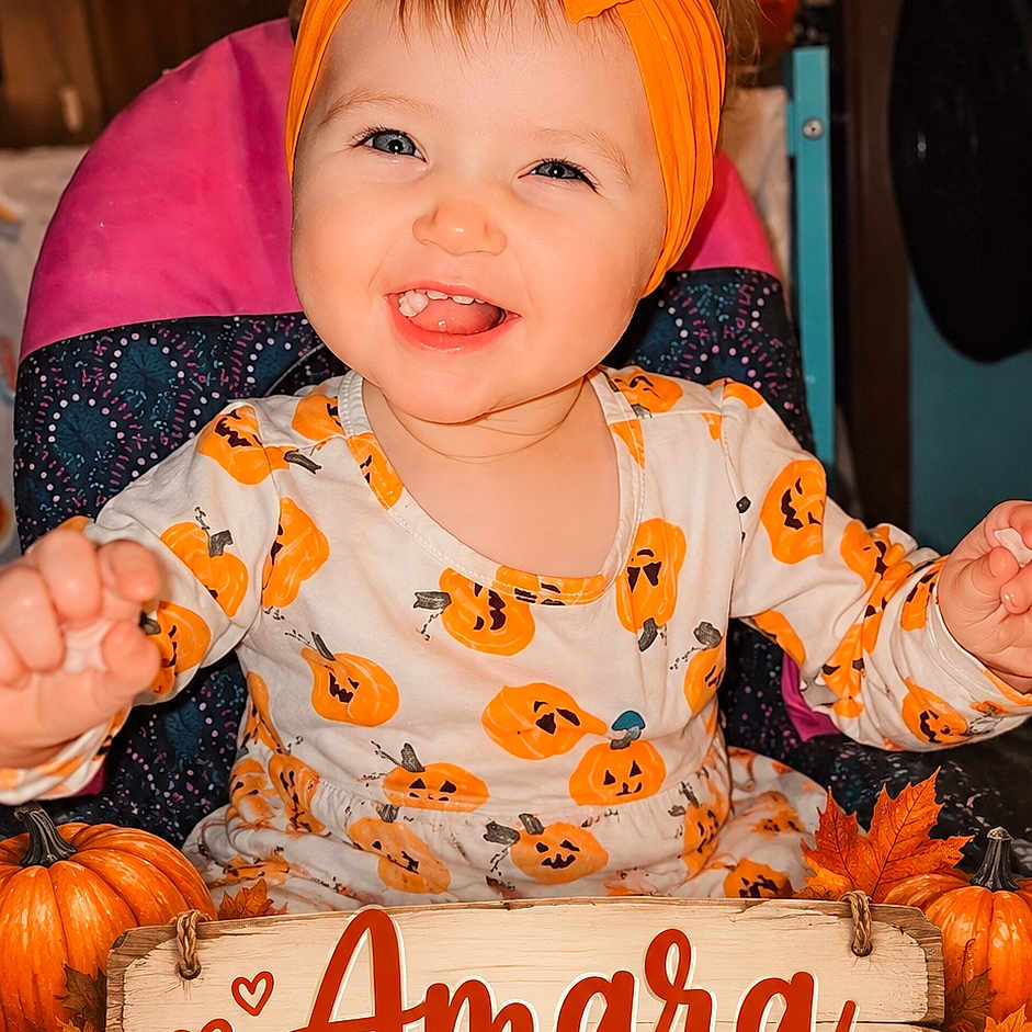 Amara joined the competition — help win amazing prizes! baby, infant, child, smiling, happy, portrait, indoor, autumn, halloween, pumpkins, fall_leaves, orange_bow, headband, baby_outfit, milestone_photo, wooden_sign, sitting, high_chair, festive, family_photo