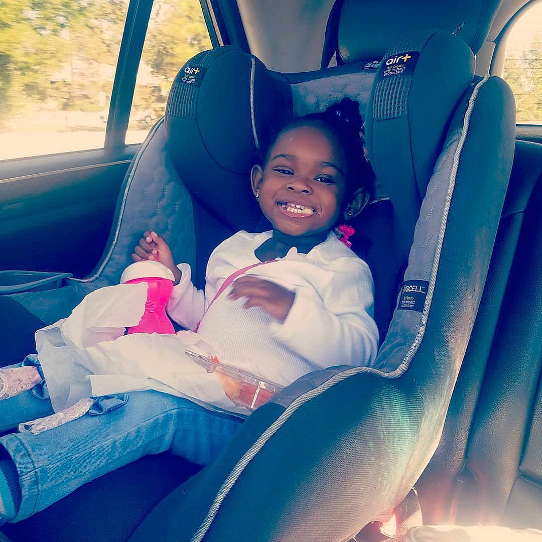 Brazil is registered to the contest to win money with this photo: automotive_design, automotive_exterior, blue, car, car_seat, car_seat_cover, child, comfort, cool, finger, happy, head_restraint, joy, leisure, motor_vehicle, person, product, smile, steering_wheel, toddler