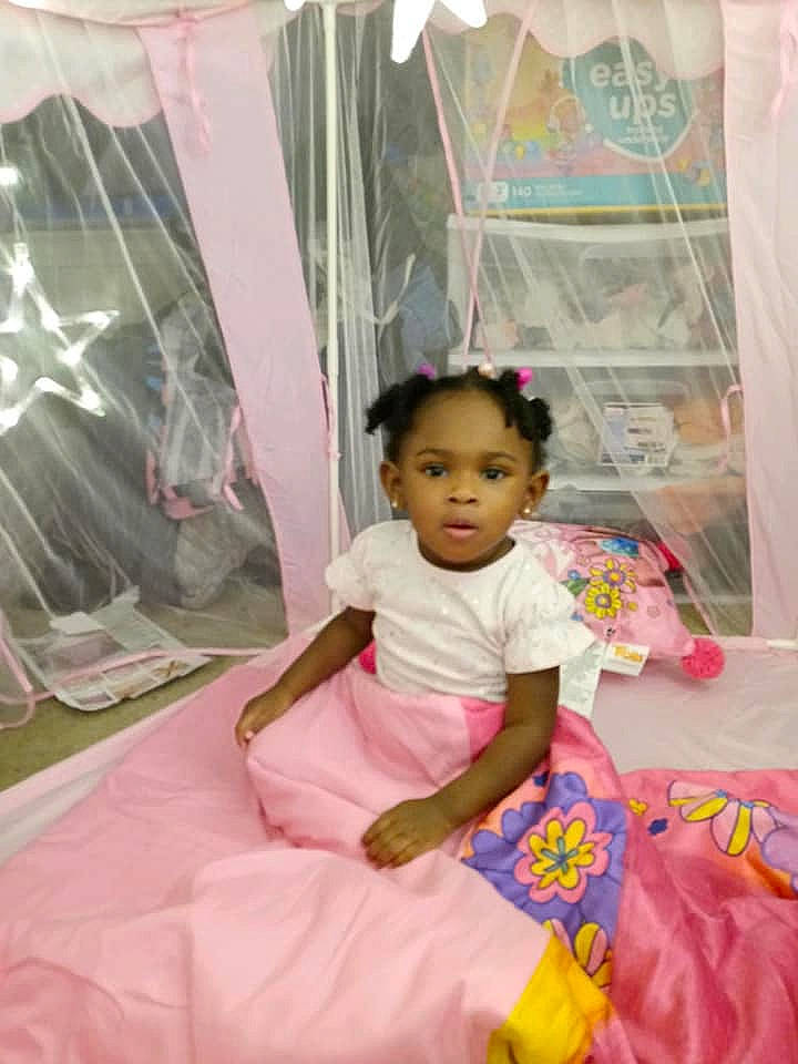 Brazil is registered to the contest to win money with this photo: baby, baby_toddler_clothing, child, curtain, event, fashion_design, fun, happy, leisure, linens, magenta, pattern, peach, person, pink, recreation, room, sitting, sleeve, textile