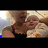 Zauntee Sebastian is registered to the contest to win money with this photo: woman, baby, tattoo, selfie, indoor, joy, surprise, onesie, child, person, portrait, casual, light, face, expression, holding, family, cute, toddler, smile