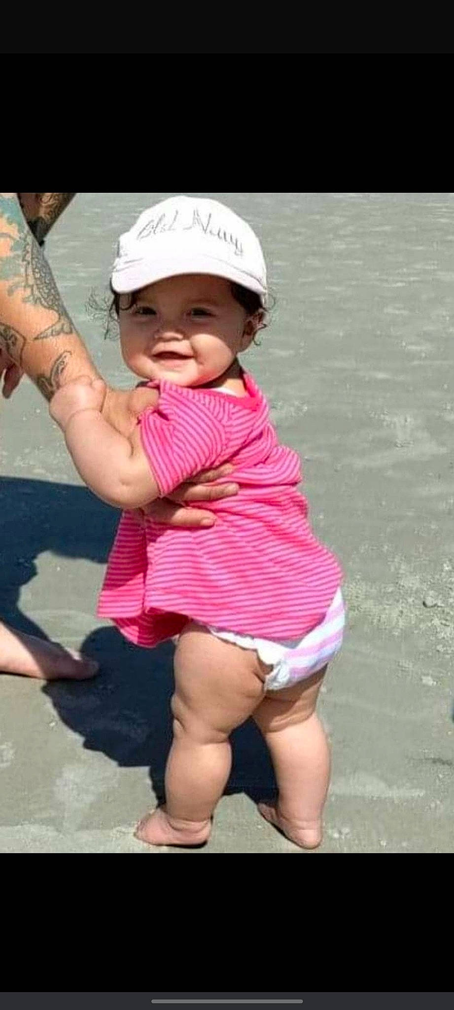 Mariella is registered to the contest to win money with this photo: baby_toddler_clothing, baseball_cap, cap, face, finger, gesture, happy, hat, head, headgear, headwear, leg, person, photograph, pink, skin, sleeve, smile, thigh, thumb