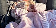 Hawika joined the competition — help win amazing prizes! baby, blanket, car_seat, child, clothing, cozy, headband, indoors, infant, mittens, newborn, peaceful, pink, portrait, protection, resting, seat, sleeping, soft, sunlight
