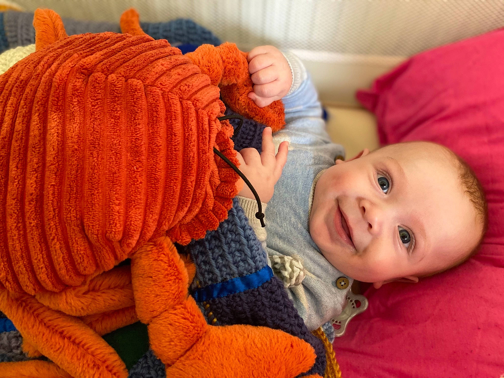 Bowie is registered to the contest to win money with this photo: baby_toddler_clothing, cheek, comfort, creative_arts, eye, finger, flooring, head, headgear, human_body, iris, joy, mouth, nose, orange, organ, person, skin, smile, textile