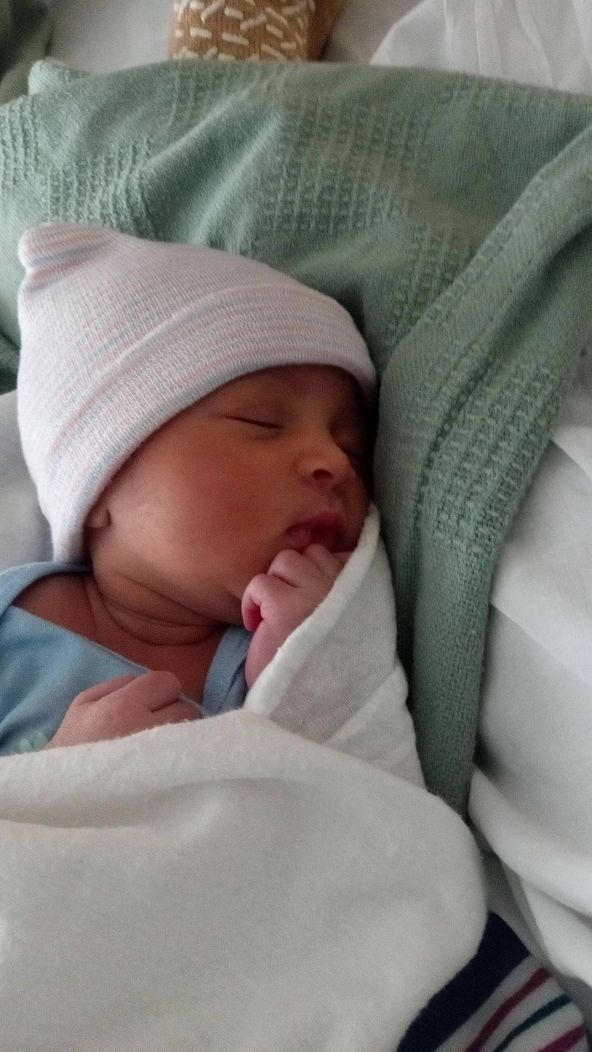 Raelyn is registered to the contest to win money with this photo: baby, baby_products, baby_sleeping, baby_toddler_clothing, bedtime, blanket, cap, carmine, cheek, child, comfort, headwear, linens, nap, person, room, skin, sleep, textile, thumb