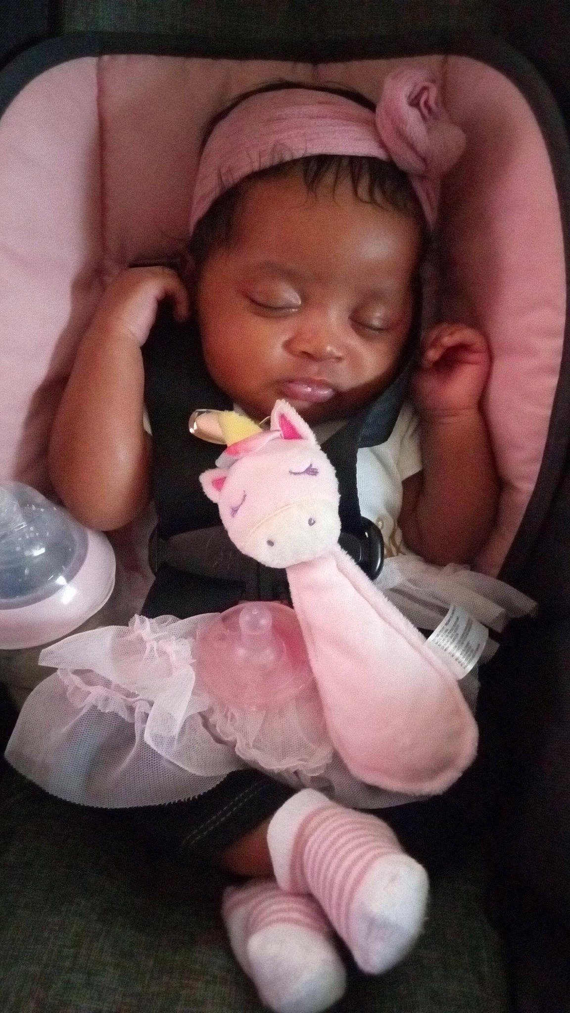 Raelyn joined the competition — help win amazing prizes! baby, baby_toddler_clothing, cheek, child, drinkware, eyelash, facial_expression, finger, gesture, happy, lip, mouth, nail, nose, person, pink, plastic_bottle, skin, stuffed_toy, thumb