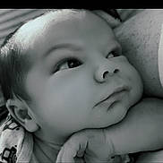 Carter is registered to the contest to win money with this photo: baby, infant, face, closeup, black_and_white, hand, resting, expression, thoughtful, cozy, blanket, portrait, young_child, skin, head, person, cute, sleepy, soft_light, calm