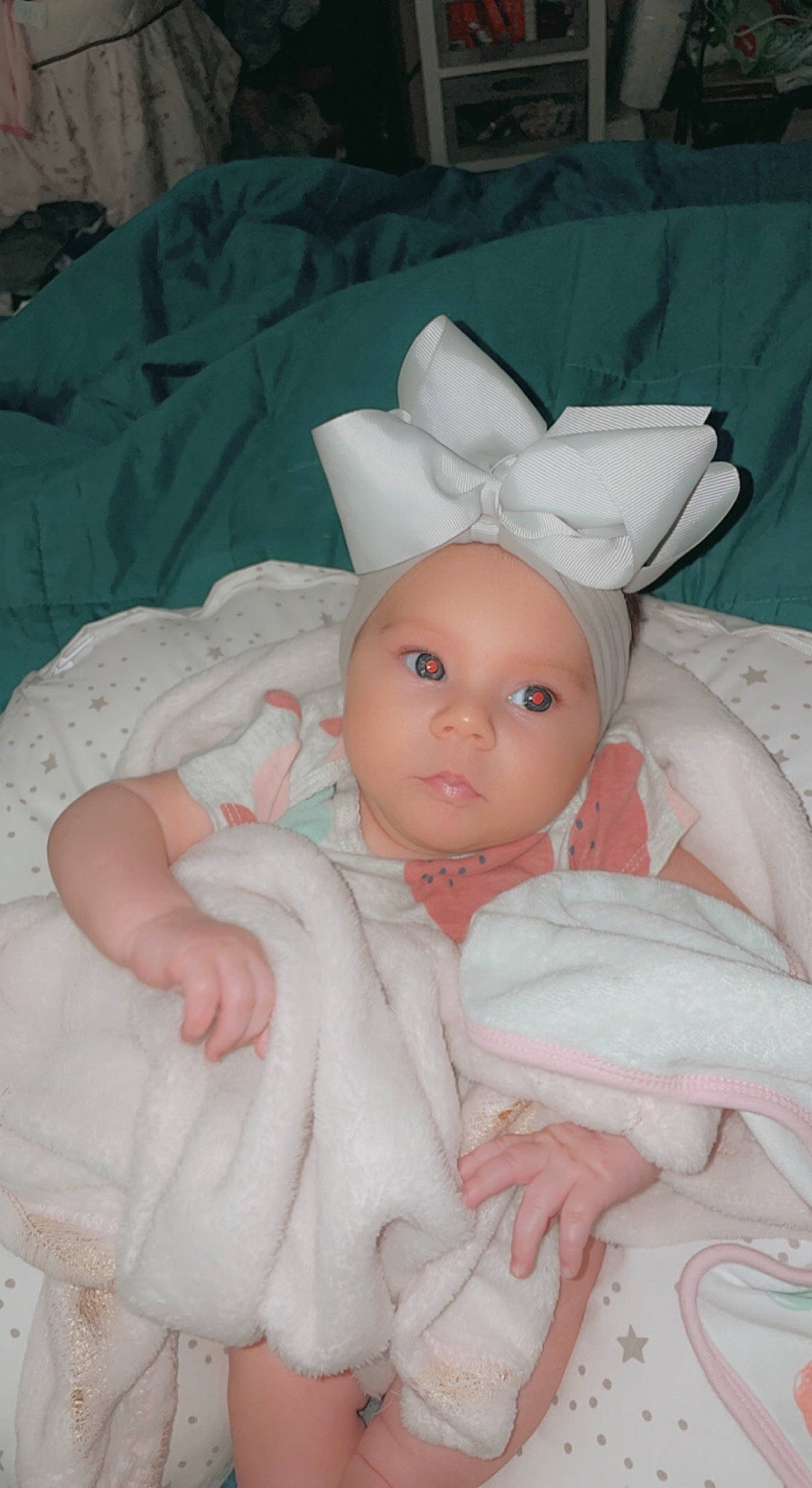 Charlotte is registered to the contest to win money with this photo: baby, baby_products, baby_toddler_clothing, bedding, cheek, child, comfort, dress, ear, eye, head, headgear, headpiece, iris, linens, lip, person, pink, skin, textile