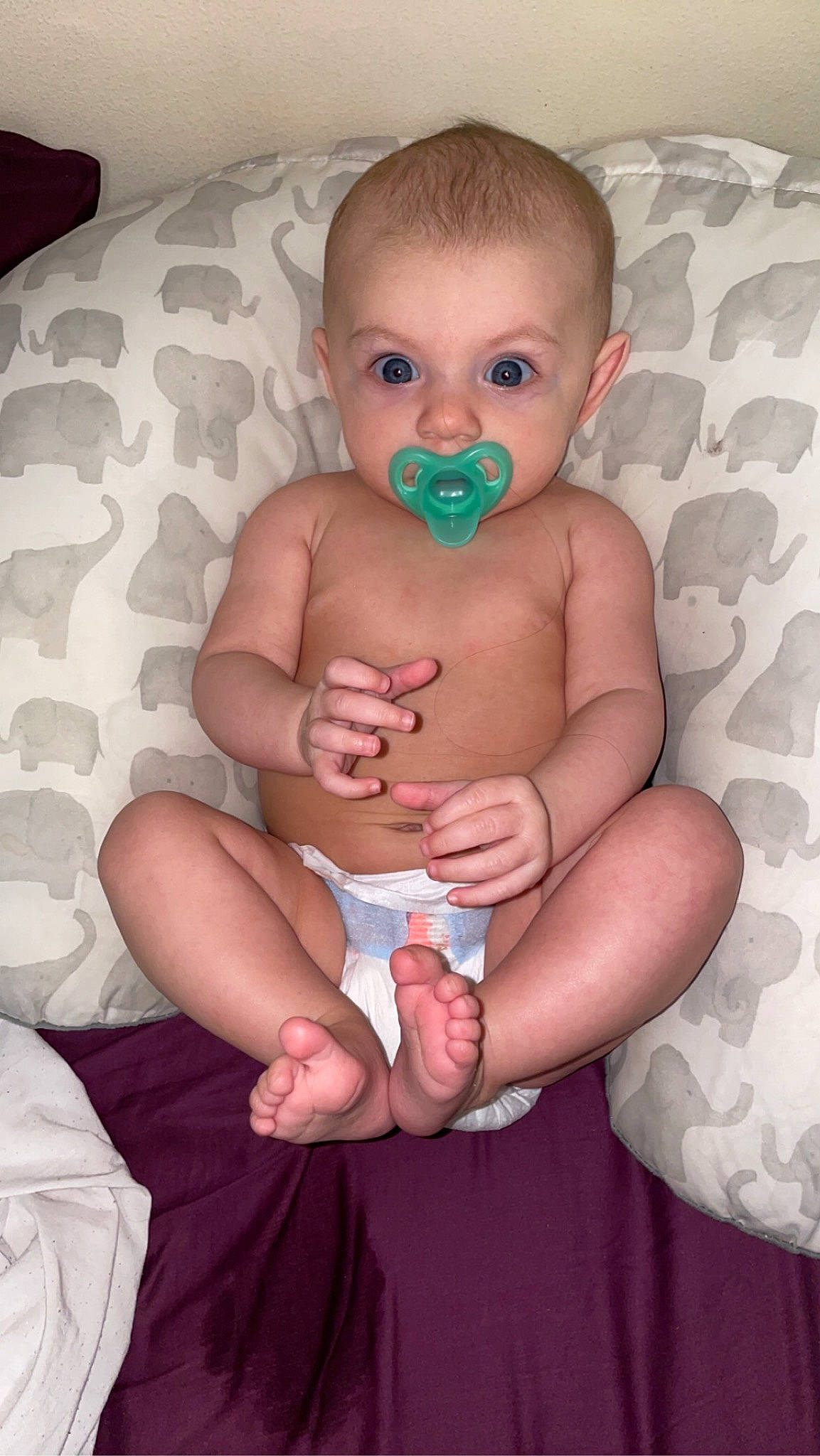 Charlotte is registered to the contest to win money with this photo: abdomen, baby, baby_toddler_clothing, cheek, chest, child, comfort, finger, gesture, hand, human_leg, mouth, nail, person, sitting, skin, stomach, thigh, thumb, toddler