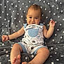 Raiden joined the competition — help win amazing prizes! baby, child, smiling, sitting, romper, blue, white, polka_dot, blanket, feet, happy, indoors, cute, infant, face, skin, arm, leg, foot, portrait