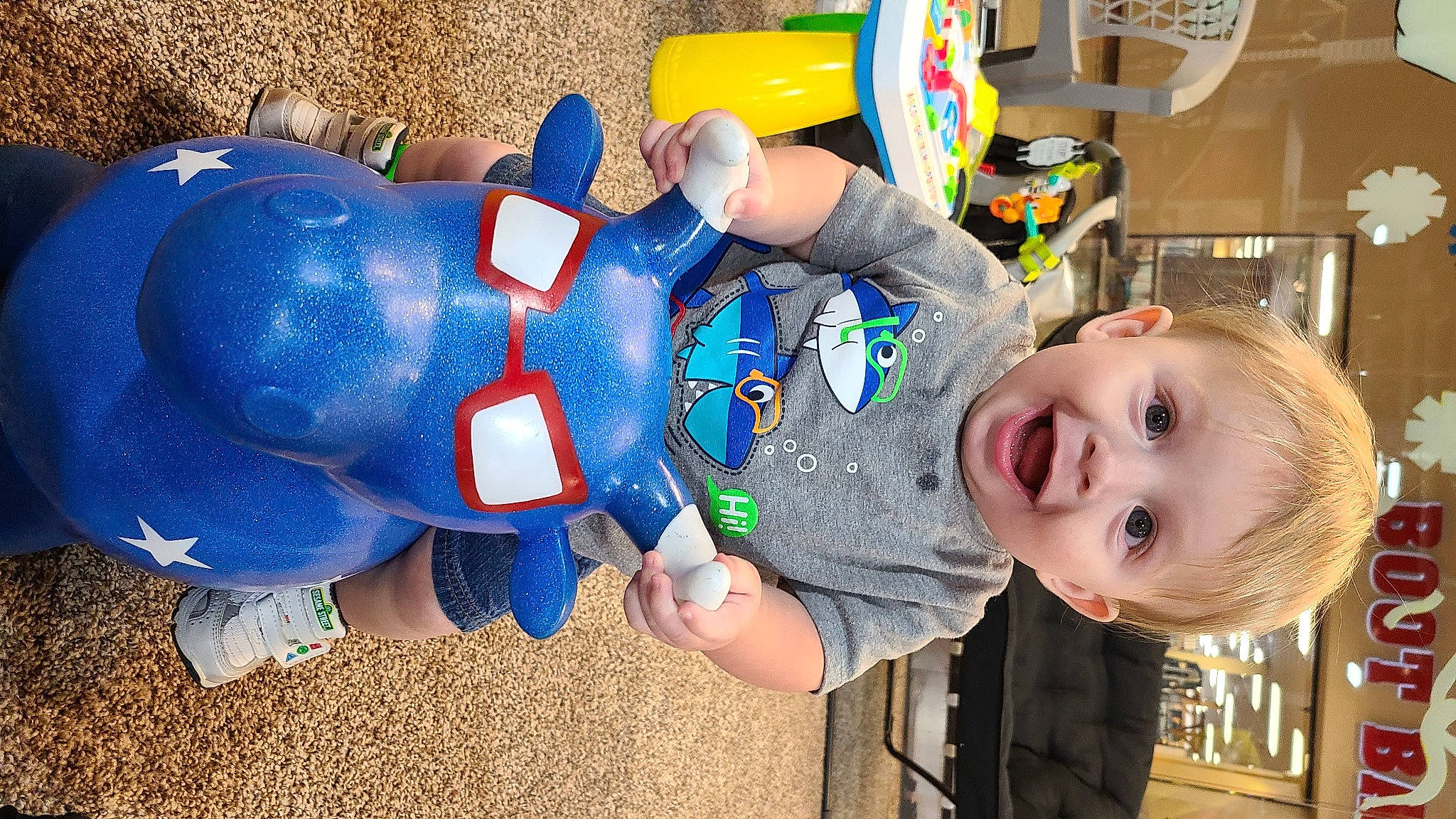 Sherman is registered to the contest to win money with this photo: baby, baby_products, baby_toddler_clothing, baby_toys, blond, child, cobalt_blue, electric_blue, fictional_character, majorelle_blue, person, plastic, play, superhero, toddler