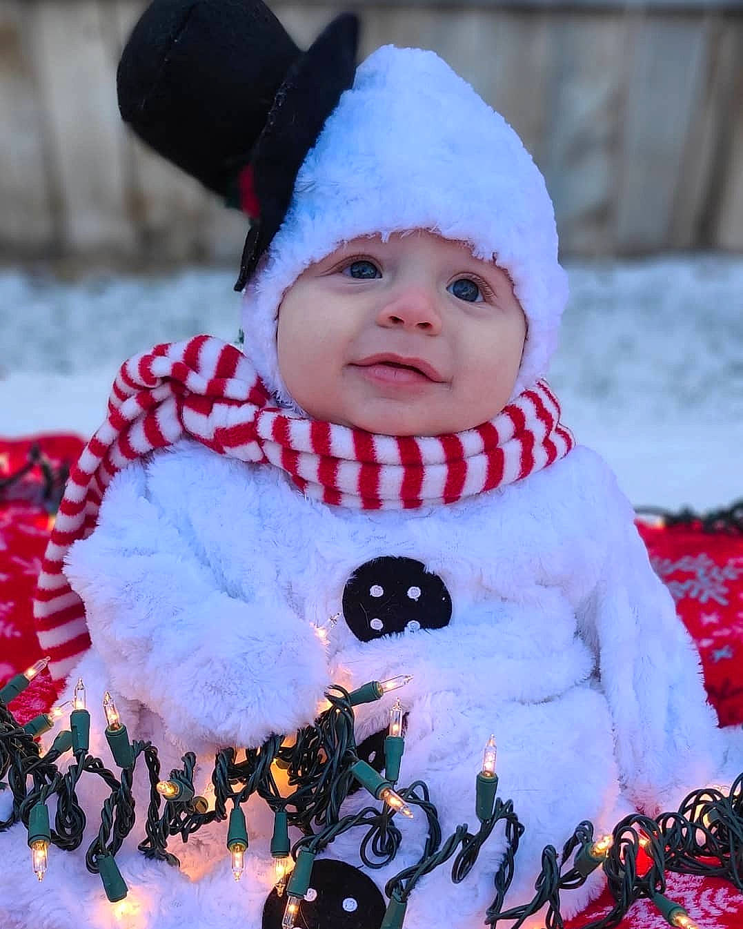 Sherman joined the competition — help win amazing prizes! baby, baby_toddler_clothing, bonnet, cheek, christmas, costume, costume_accessory, costume_hat, craft, creative_arts, embellishment, freezing, fur, headgear, headwear, human, person, pink, snow, winter