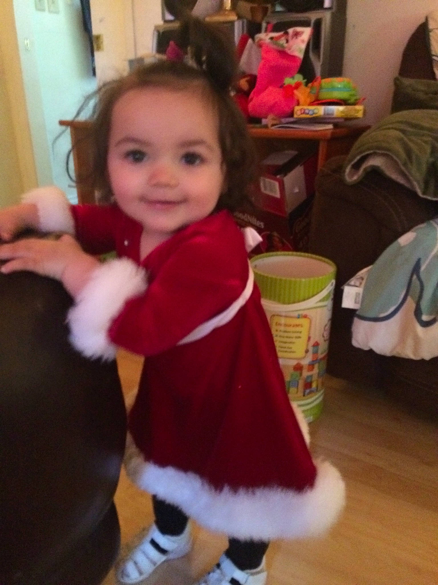 Ana is registered to the contest to win money with this photo: baby, child, christmas, christmas_eve, costume, dress, fawn, fictional_character, fur, head, holiday, outerwear, person, play, shoe, skin, smile, toddler